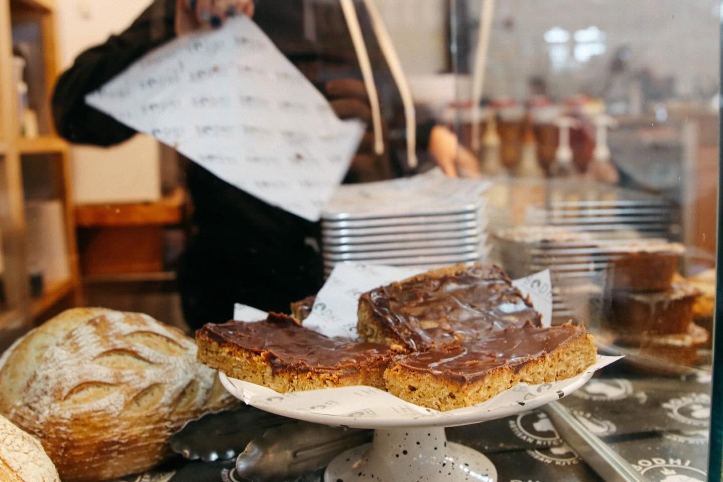 Bakery display with chocolate frosted cake slices