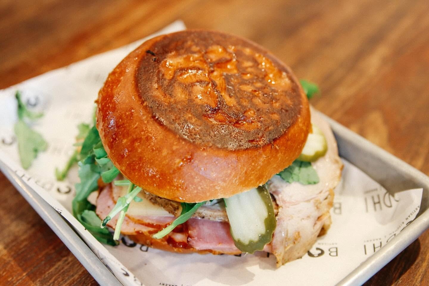 Gourmet sandwich on a glazed bun