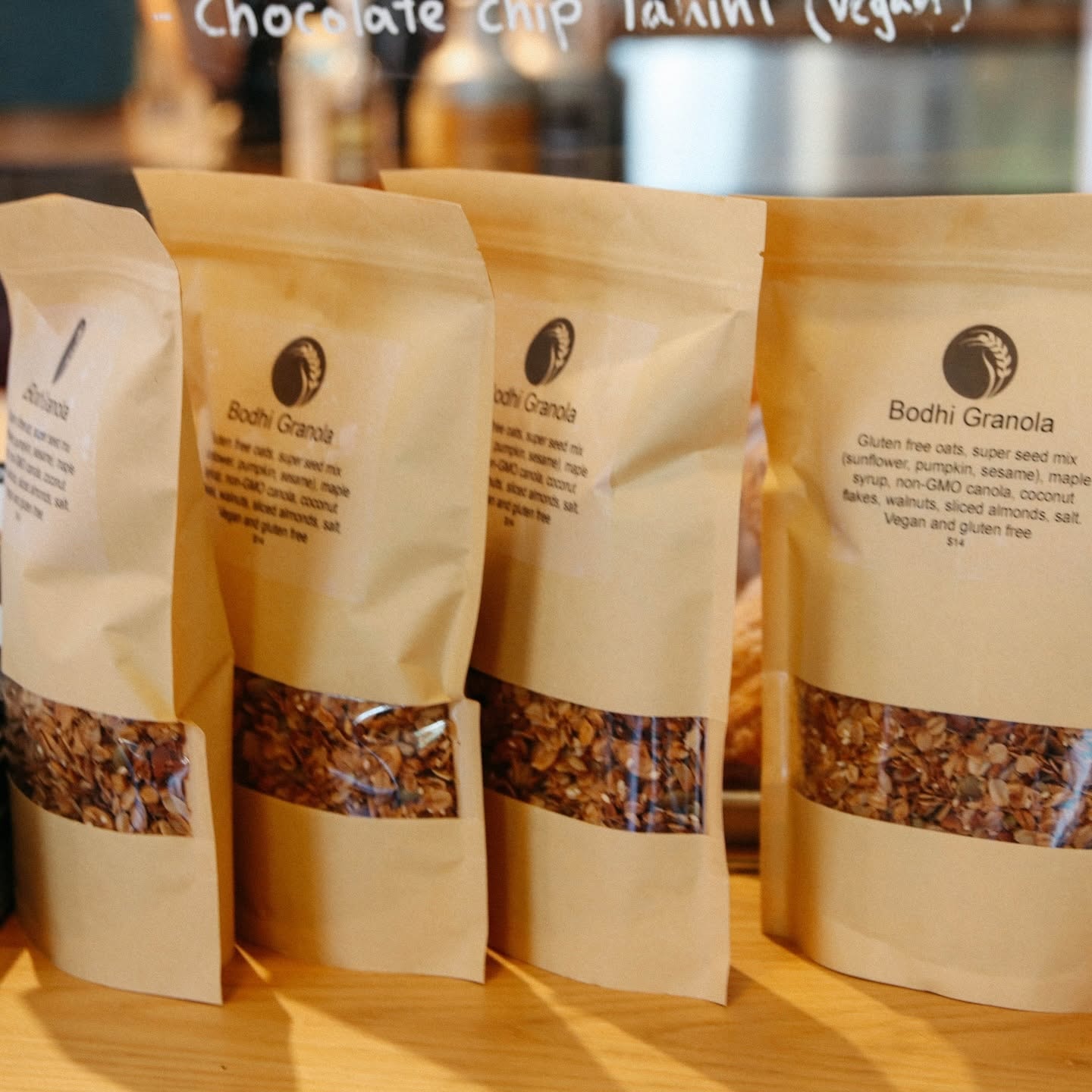 Bodhi Granola kraft bags lined up on the counter — gluten free, vegan