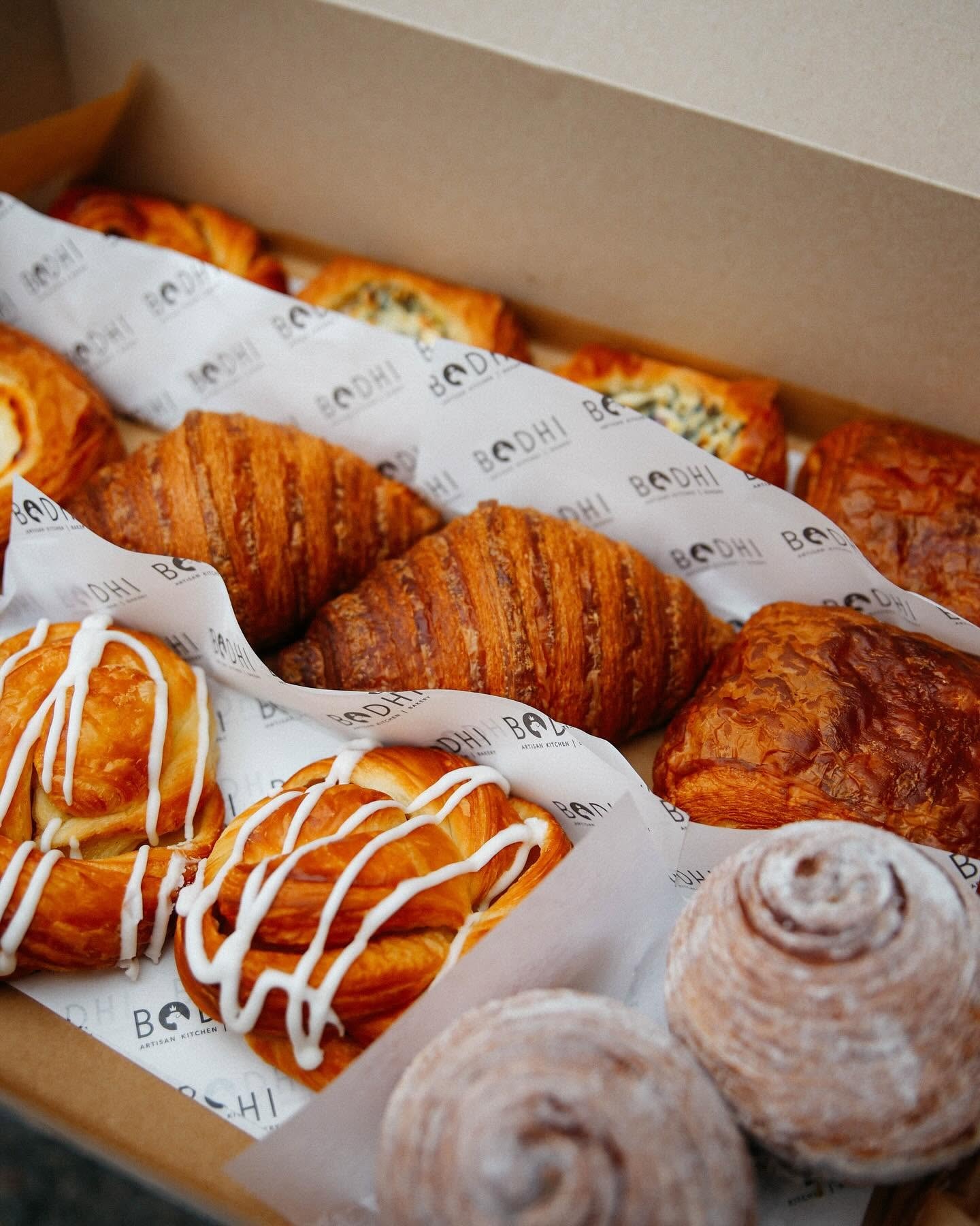 Assorted pastries and croissants in a box